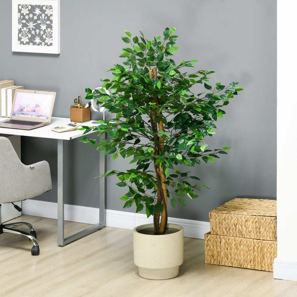 The artificial ficus tree in a home office setting next to a desk and storage baskets