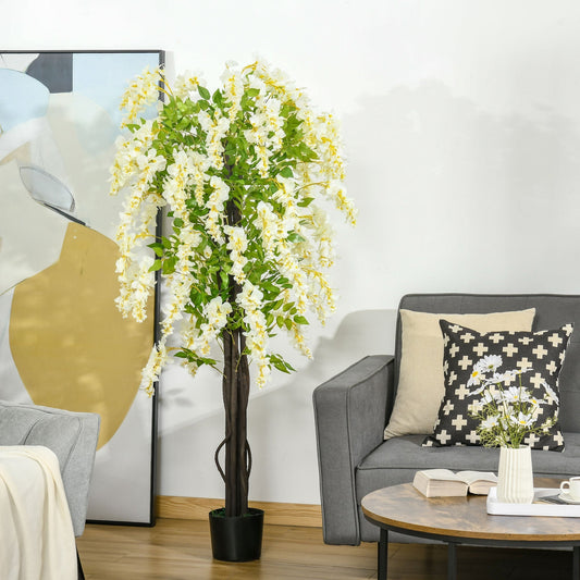 The artificial plant white wisteria tree placed in a living room next to a sofa and coffee table