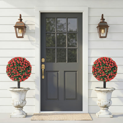 The artificial rose topiary plants flanking a doorway on a patio