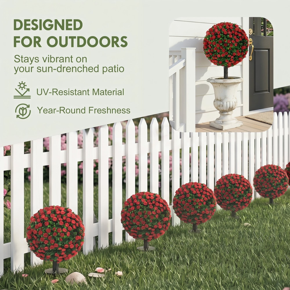 The artificial rose topiary plants displayed outdoors along a fence