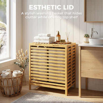 The laundry basket with the lid closed and items placed on top in a bright bathroom setting