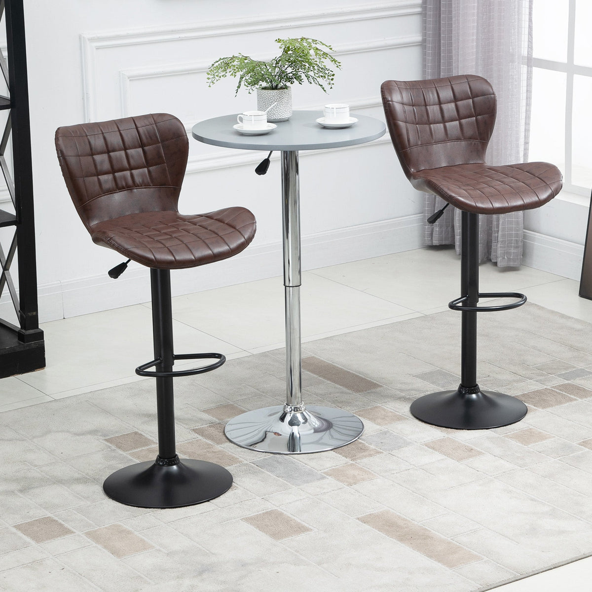 Two brown PU leather bar chairs with backrests in a room setting with a small table