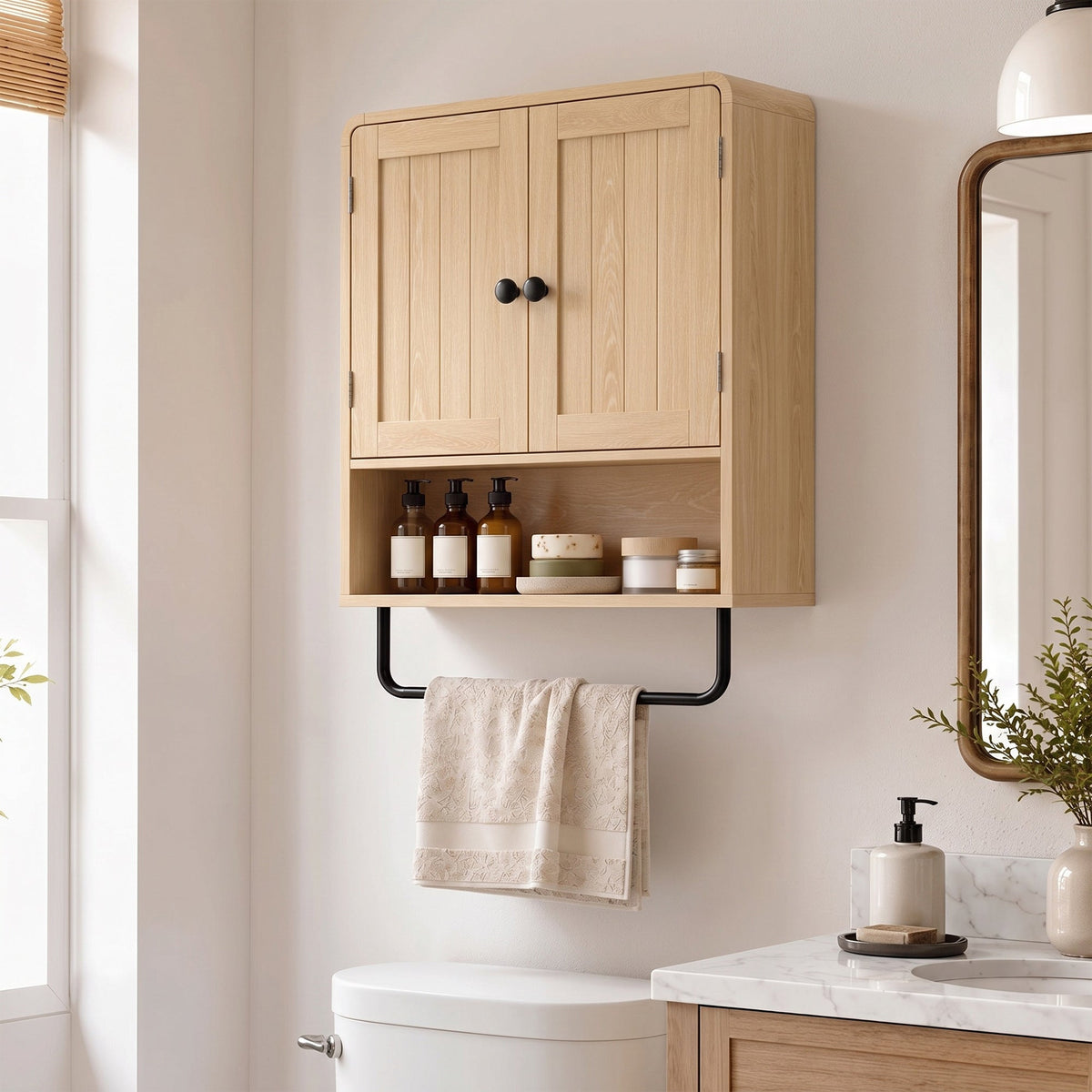 The bathroom cabinet mounted on a wall above a toilet with toiletries and a towel displayed