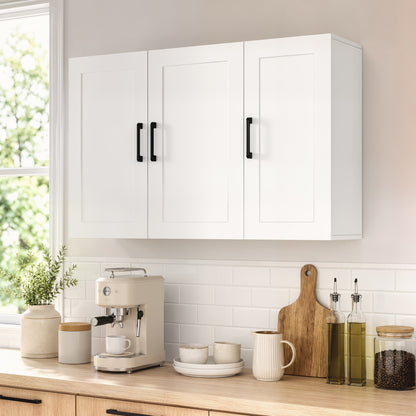 The bathroom cabinet above a kitchen counter with a coffee machine and utensils