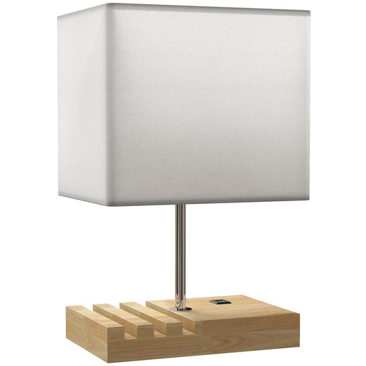 HOMCOM Bedside Lamp with a white fabric shade and a wooden base featuring phone slots