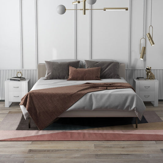 Two white bedside tables with drawers in a modern bedroom setting next to a bed