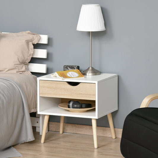 The modern nightstand is shown next to a bed with a lamp and books on top