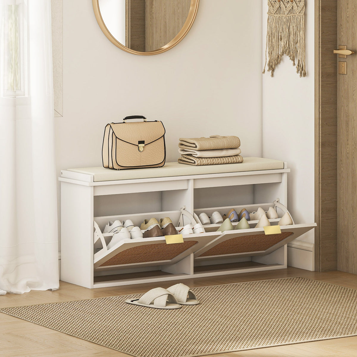 The shoe storage bench with padded seat is placed in a hallway with shoes and a handbag