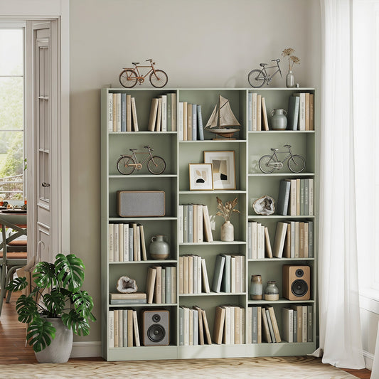 The light green bookcase filled with books and decorative items in a living room setting