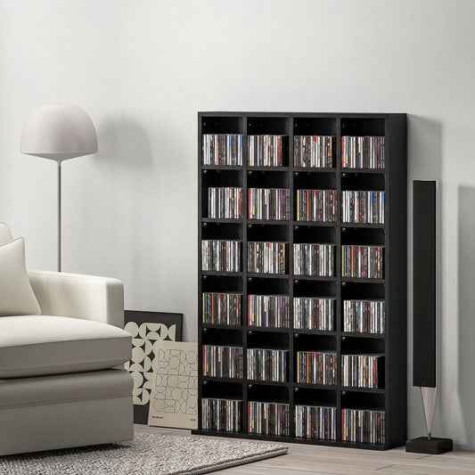 The black shelving unit filled with CDs stands in a room next to a sofa and a lamp