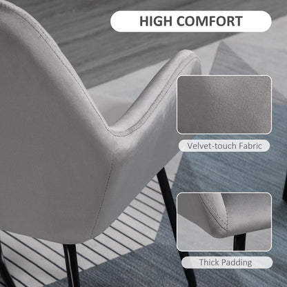 Close up of the grey upholstered accent chair showing the velvet-touch fabric and thick padding
