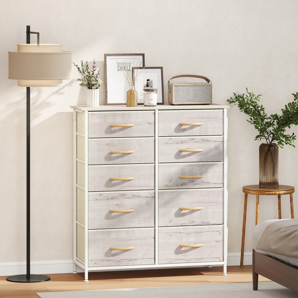 The chest of drawers in a bedroom setting with a lamp and a stool
