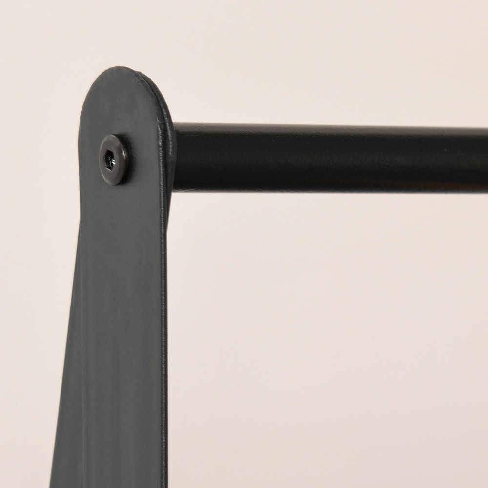Close-up of the black metal frame and fixing on the coat rack