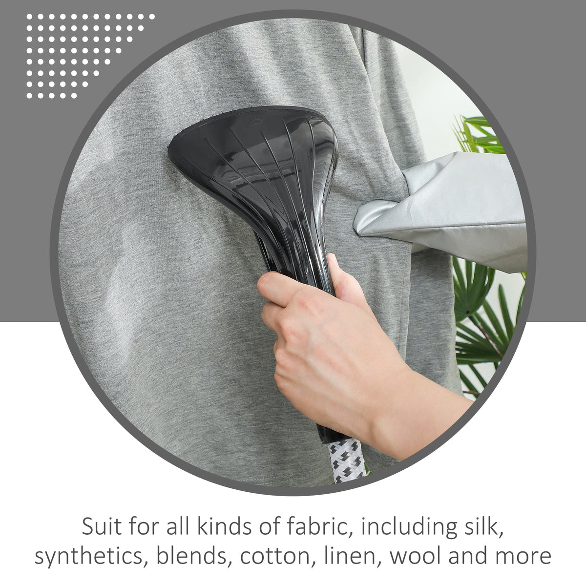 Close up of the clothes steamer nozzle being used on a grey garment