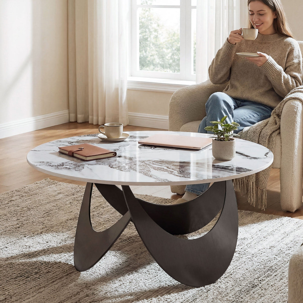 A woman drinks coffee at the modern centre table in a living room setting