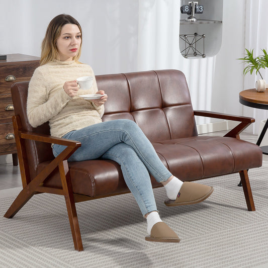 Woman sitting on the compact two seater sofa in a living room setting
