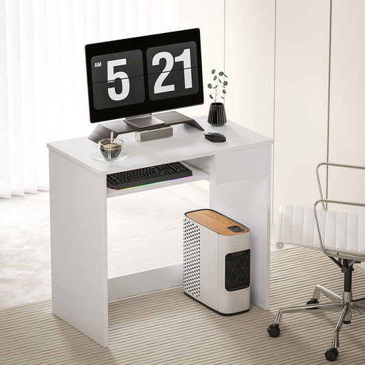 The compact computer desk with keyboard tray in a modern home office setting with a computer and chair