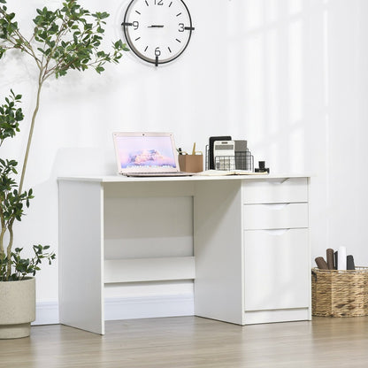 A white computer desk with drawers set up in a home office with a laptop and plant
