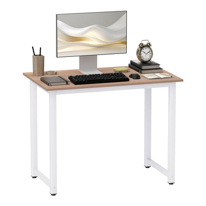 HOMCOM Computer Desk with a white metal frame and light wood effect top, shown with a monitor and keyboard