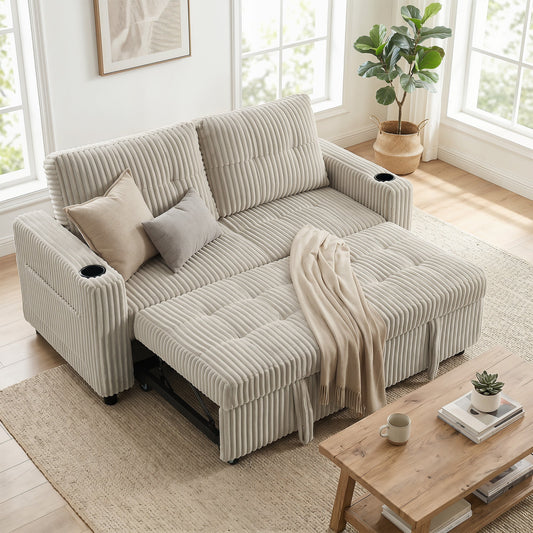 The cream white corduroy sofa bed is set up as a sofa in a living room with a blanket and cushions