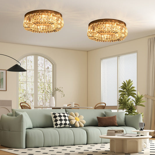 Two modern crystal ceiling lights fitted in a living room above a sofa and coffee table