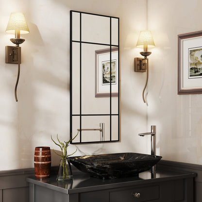 The decorative grid wall mirror is hung above a sink in a bathroom setting