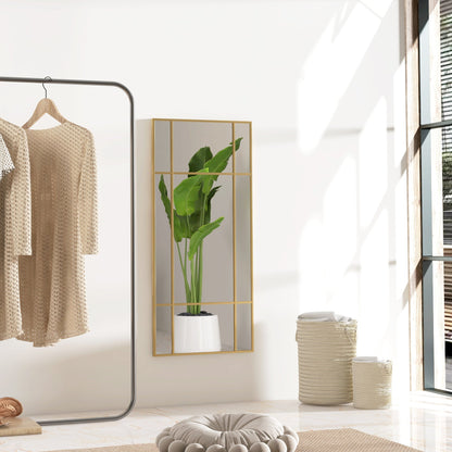 The wall mirror mounted on a white wall in a bright room reflecting a green houseplant
