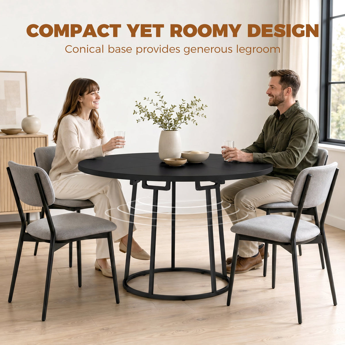 The dining furniture in a light room with two people sitting comfortably at the table