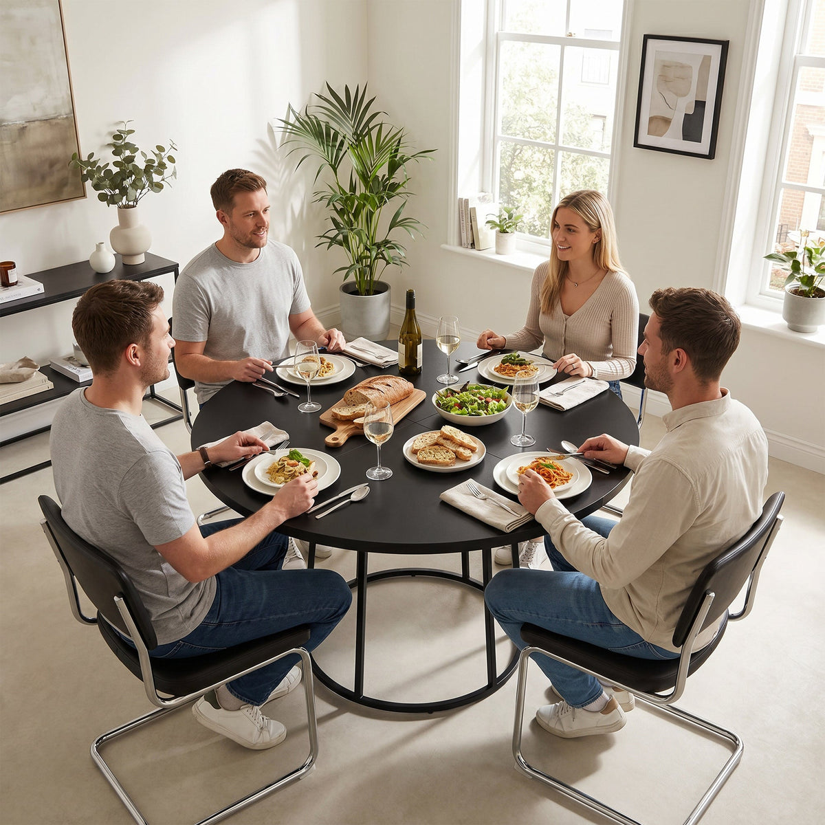 The dining furniture in a modern home with four people gathered around for a lunch