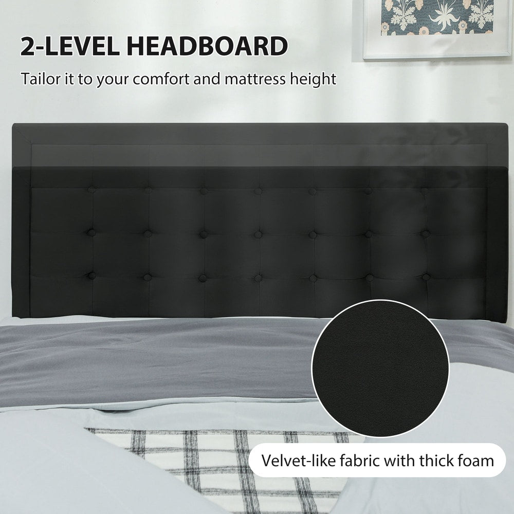 The black upholstered headboard of the double bed frame with velvet-like fabric detail