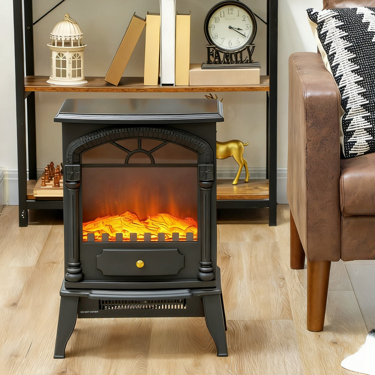 The black electric stove heater is placed in a living room setting