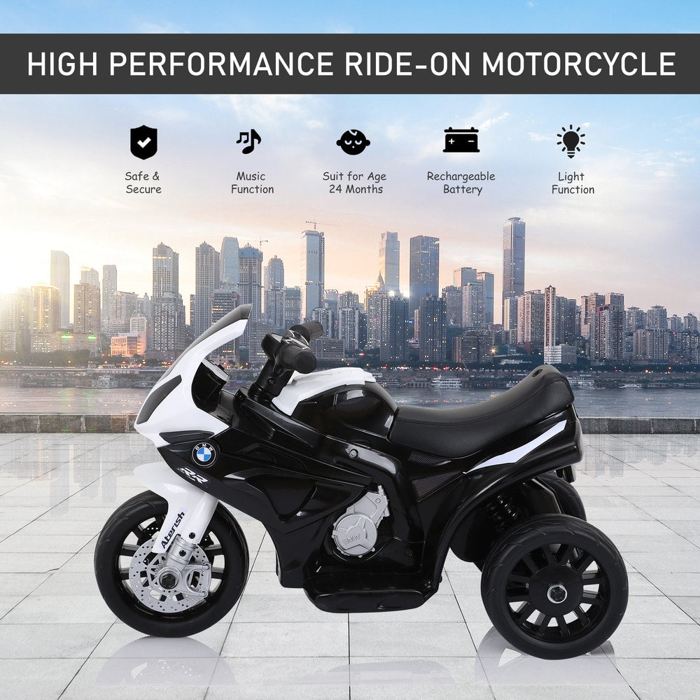 The kids electric motorbike displayed against a city skyline background with feature icons