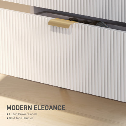 A close-up of the fluted drawer panel and gold handle on the chest of drawers
