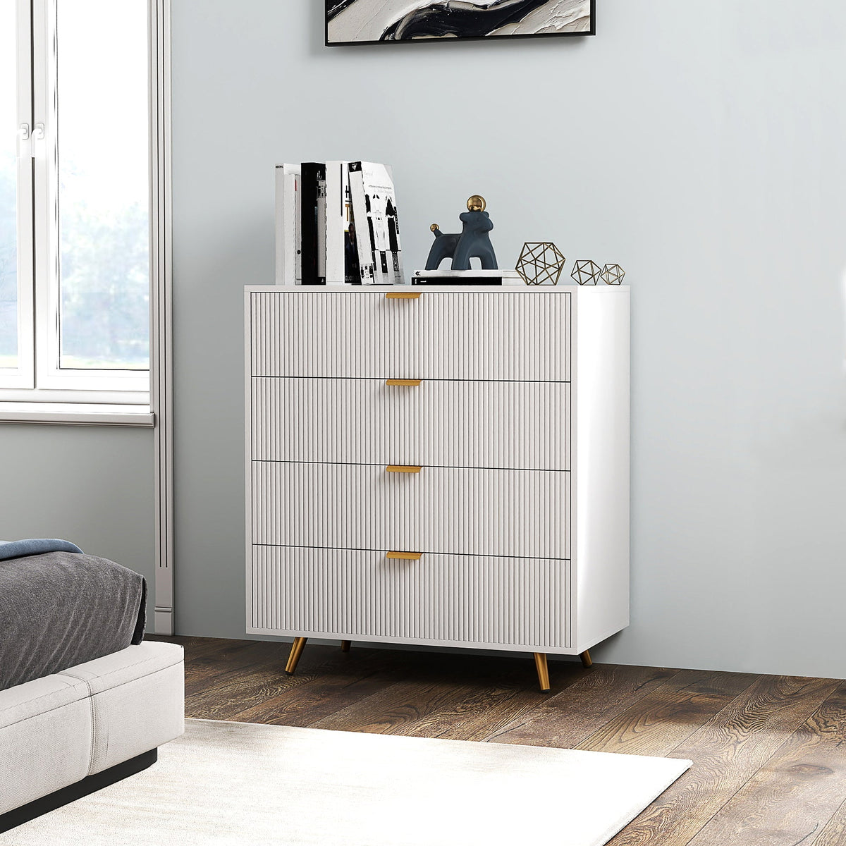 The chest of drawers placed in a bedroom next to a bed with decorative items on top