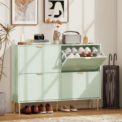 Light green four-drawer shoe storage cabinet in a hallway with shoes inside and on the floor