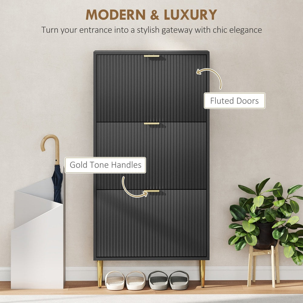 Black shoe storage cabinet with fluted doors and gold tone handles