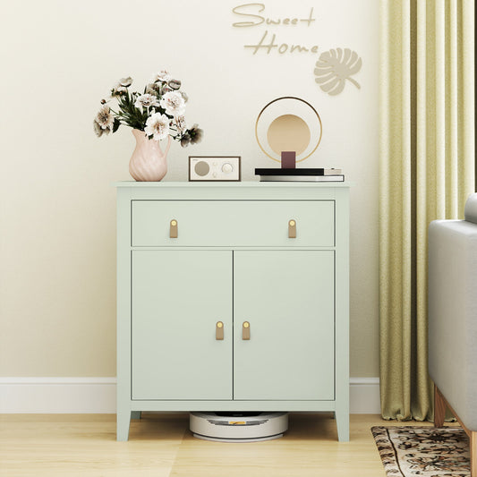 Light green farmhouse style sideboard in a living room with decorative items