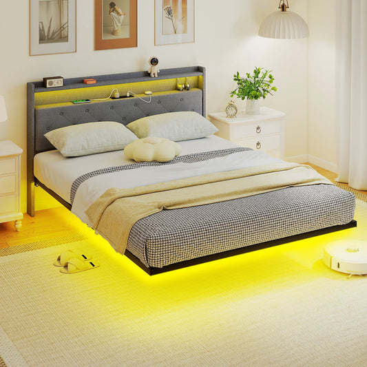 The upholstered bed set up in a bedroom with yellow under-bed lighting and bedding