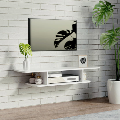 The white wall-mounted media console is shown in a room with a TV above it and decorative items on the shelf