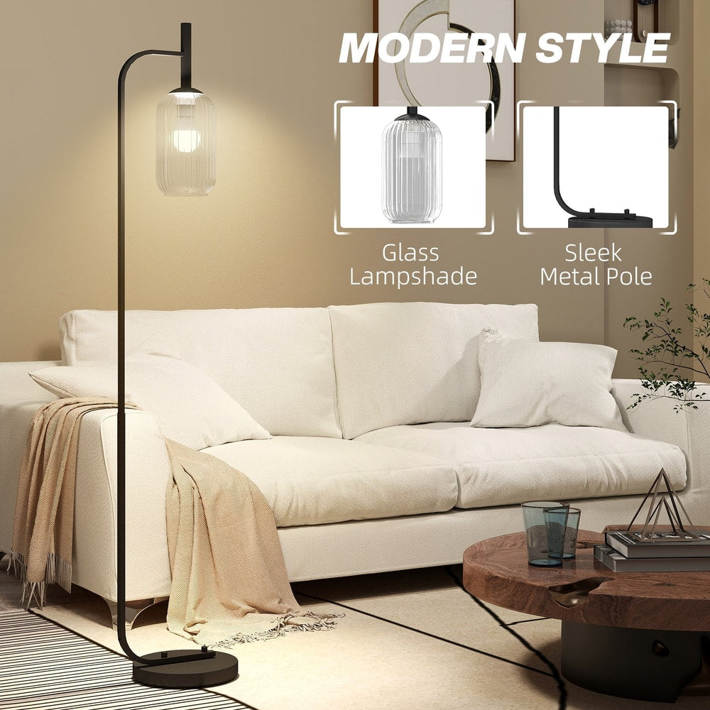 Close up of the floor lamp's glass lampshade and sleek metal pole