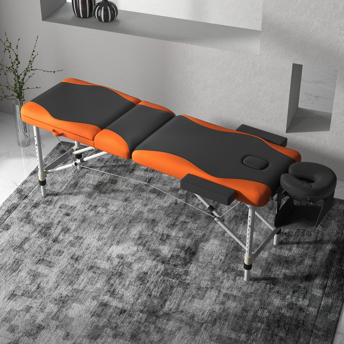 The massage table set up in a modern room with a grey patterned rug