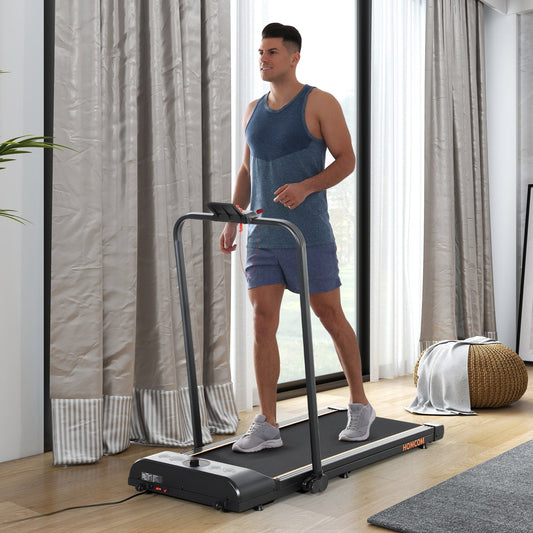 Man walking on the orange foldable walking treadmill in a living room