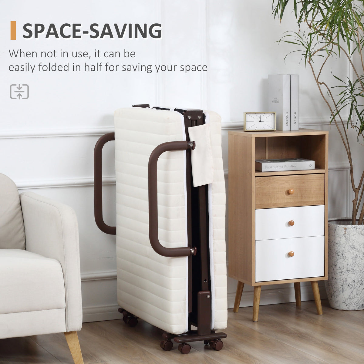 The metal frame bed folded in half standing upright next to a wooden bedside cabinet