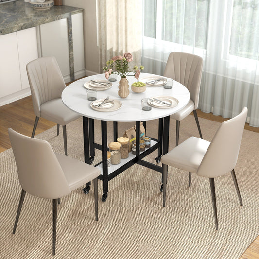 The drop leaf table is set up for dining with four chairs around it and items on the shelf