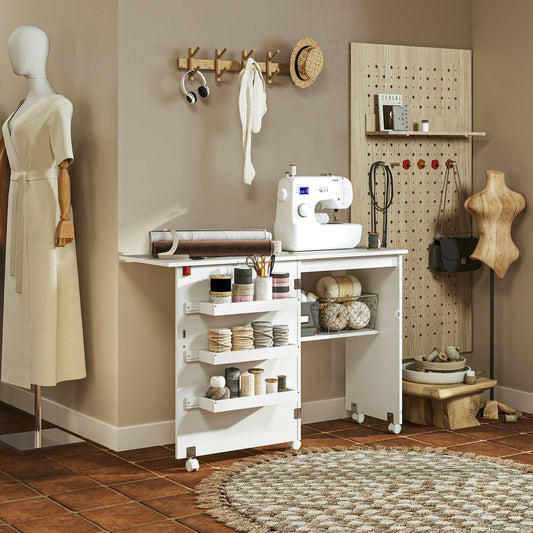 The office desk set up in a craft room with a sewing machine and various sewing supplies