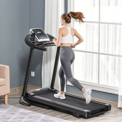 Woman running on a folding treadmill in a bright room