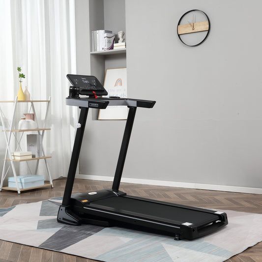 The black folding treadmill set up in a modern living room on a rug