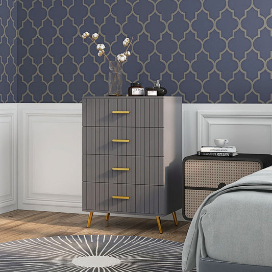 Grey chest of drawers with gold handles in a bedroom setting next to a bed
