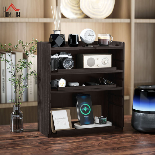 Dark brown four-tier desk organiser with a phone charging, watch and earbuds on shelves