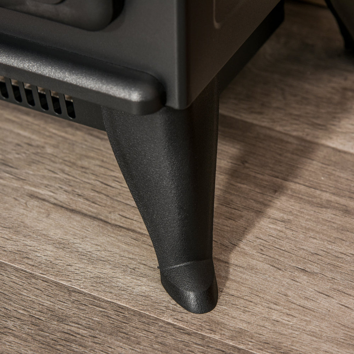 Close-up of the sturdy legs on the electric log burner